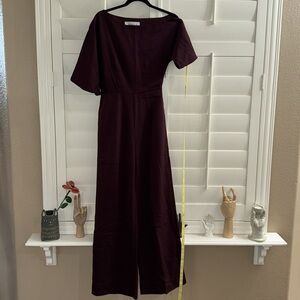 ALIEVA ANA OFF SHOULDER JUMPSUIT BLACK CHERRY